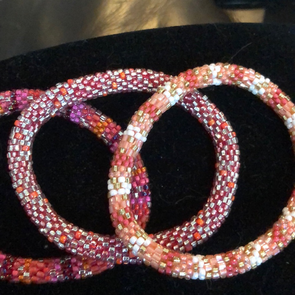 Three multi color bracelets